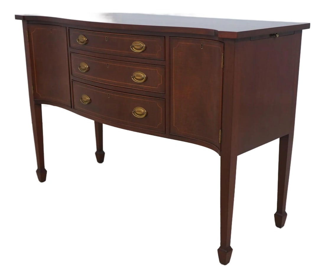 Elegant Biggs Mahogany Serpentine Sideboard with Brass Hardware: Elegant Biggs Mahogany Serpentine Sideboard with Brass Hardware This elegant Biggs Mahogany Serpentine Front Sideboard Server showcases exquisite craftsmanship, featuring dovetailed drawer constructio
