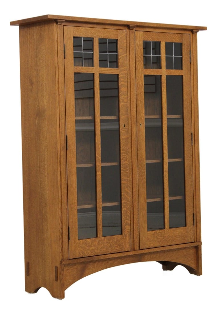 46w x 14d x 58h Stickley oak bookcase with leaded glass panels: 46w x 14d x 58h Stickley oak bookcase with leaded glass panels Mission-style oak bookcase with leaded glass top panels, adjustable shelves, and high-quality Arts & Crafts style construction. Finished 