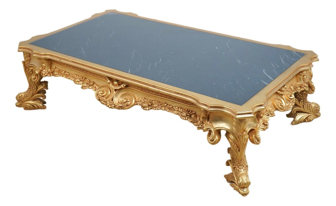 72w x 43d Gold Gilt Cocktail Table with Marble and Glass Top: 72w x 43d Gold Gilt Cocktail Table with Marble and Glass Top Baroque-style coffee cocktail table with a glass top over marble, a gold gilt finish, and an ornate carved frame. The design features dolph