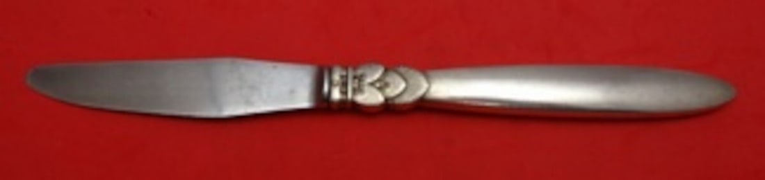 Georg Jensen Cactus Sterling Silver Luncheon Knife with GI/GJ Mark: Georg Jensen Cactus Sterling Silver Luncheon Knife with GI/GJ Mark Experience the elegance of the Cactus pattern by Georg Jensen, a masterpiece in sterling silver. This exquisite luncheon knife featur
