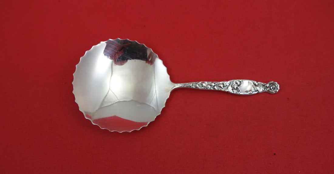 Sterling Silver Scalloped Confection Spoon Heraldic Pattern 5 Inch: Sterling Silver Scalloped Confection Spoon Heraldic Pattern 5 Inch This is a sterling silver confection spoon in the Heraldic pattern by Whiting. Featuring a scalloped solid bowl, the spoon measures 5