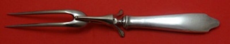 Tiffany & Co Clinton Sterling Silver Carving Fork 11 1/4 inches: Tiffany & Co Clinton Sterling Silver Carving Fork 11 1/4 inches This exquisite roast carving fork from the Clinton pattern by Tiffany & Co. features a sterling silver hollow handle and a stainless imp