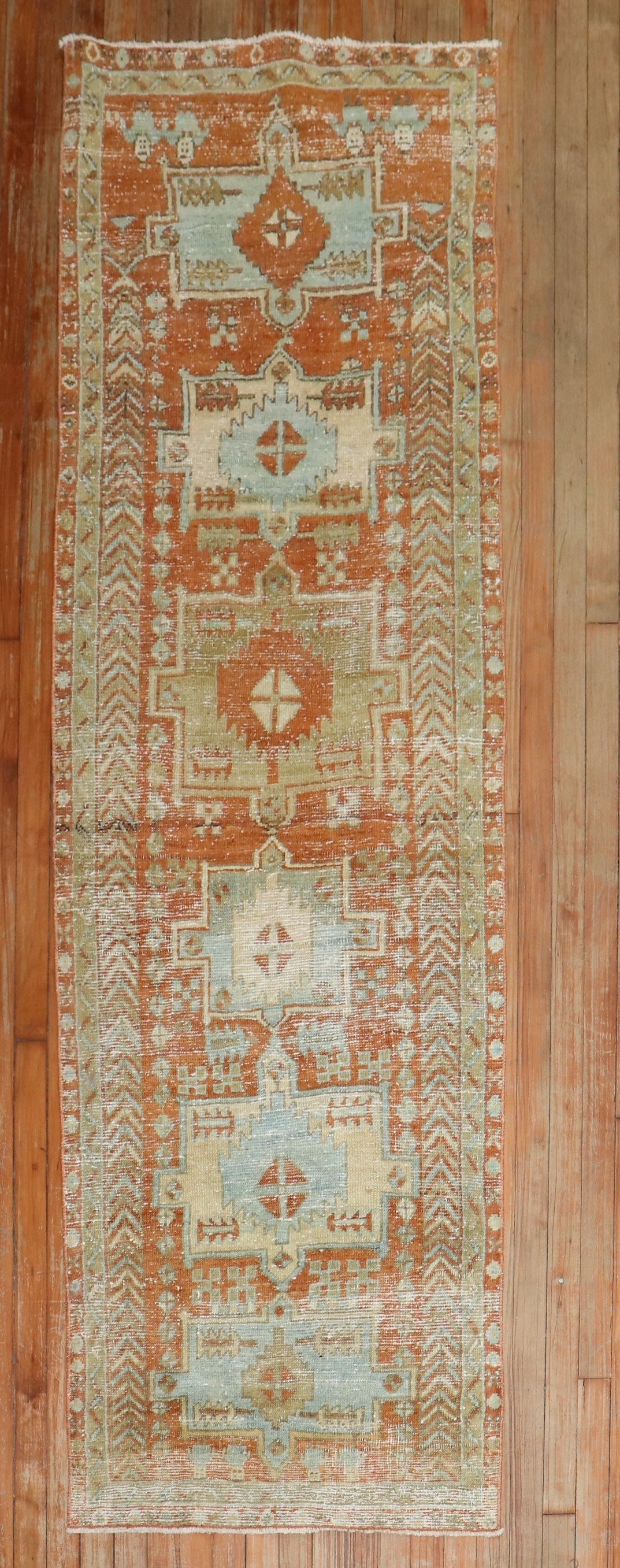 2' 7" x 8' 2" Persian Serapi Heriz Rug Runner Orange: 2' 7" x 8' 2" Persian Serapi Heriz Rug Runner Orange Early 20th century Persian Heriz runner with a worn appearance and a predominant orange color. This pre-owned piece is identified as a Serapi/Heriz