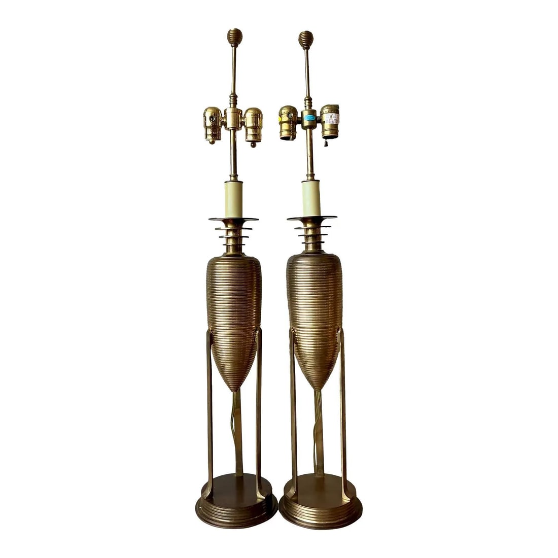 Pair of Postmodern Brass Table Lamps with Tripod Base: Pair of Postmodern Brass Table Lamps with Tripod Base This pair of vintage table lamps by Chapman showcases postmodern design with neoclassical influences. Each lamp features a heavy, ribbed beehive o