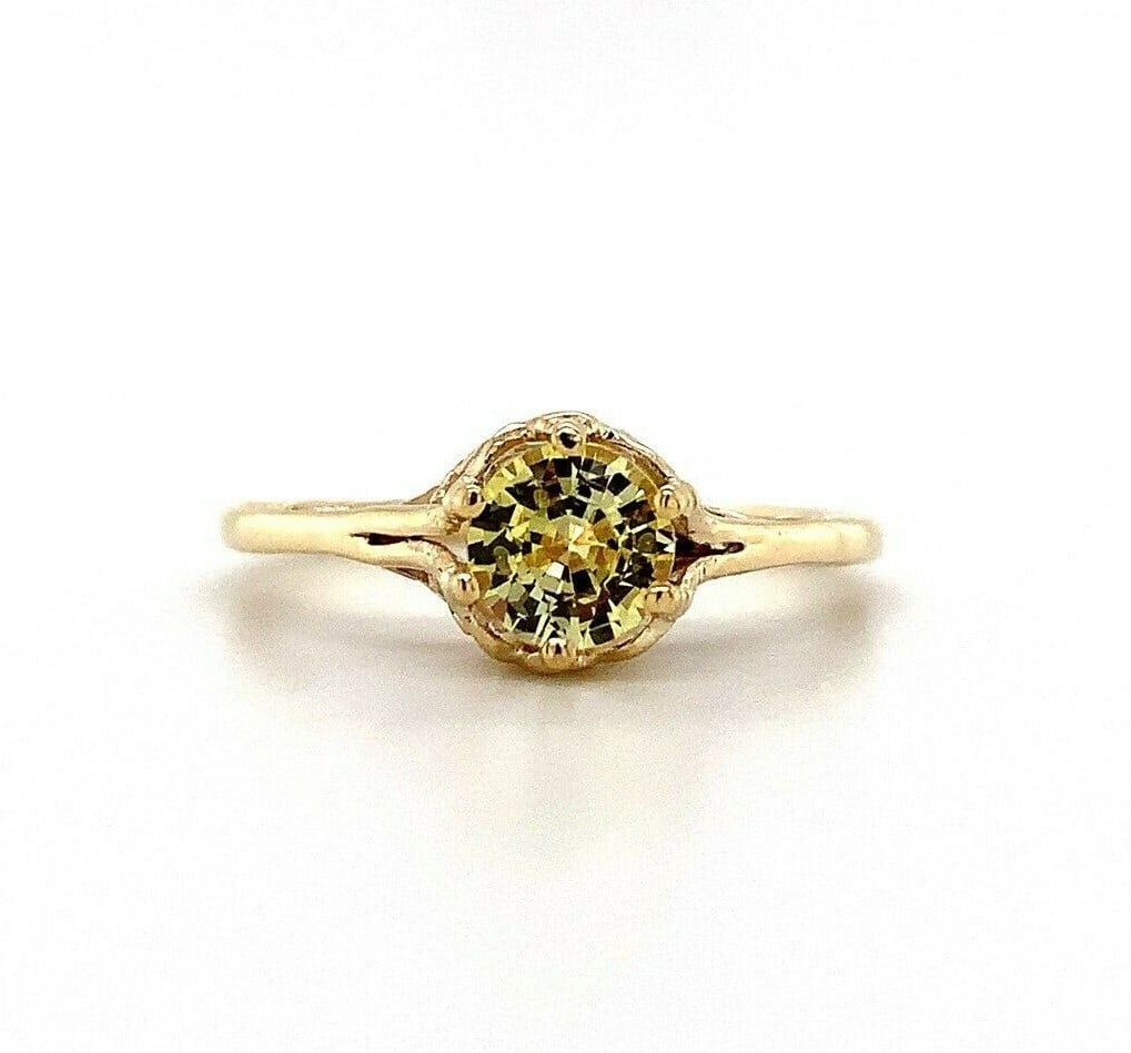 Art Deco 14k Yellow Gold Filigree Ring .61ct Yellow Sapphire: Art Deco 14k Yellow Gold Filigree Ring .61ct Yellow Sapphire This exquisite 14k yellow gold filigree ring showcases a stunning .61 ct genuine natural yellow sapphire. The ring, dating from the Art Dec