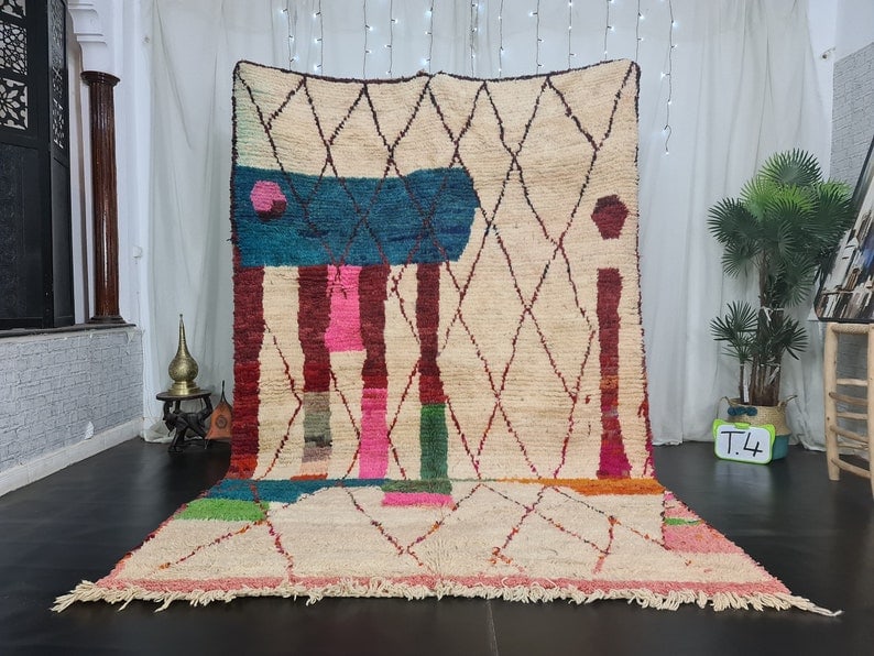 Authentic Handwoven Moroccan Berber Wool Rug 100% Sheep Wool: Authentic Handwoven Moroccan Berber Wool Rug 100% Sheep Wool Experience the beauty of authentic craftsmanship with this Elegant Handwoven Moroccan Berber Wool Rug. This stunning rug is meticulously ha