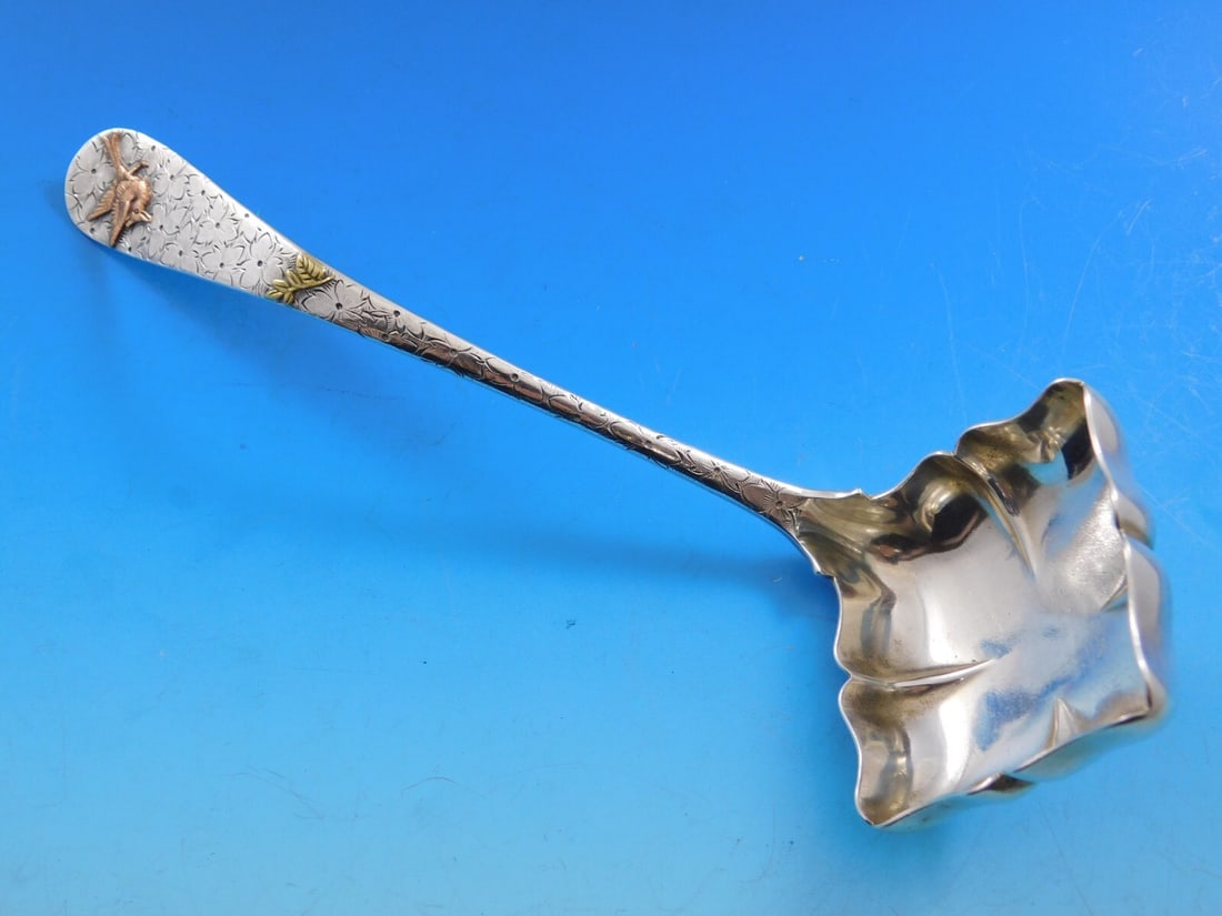 Dominick & Haff Hammered Sterling Silver Gravy Ladle 7 5/8" with Copper Bird: Dominick & Haff Hammered Sterling Silver Gravy Ladle 7 5/8" with Copper Bird Introducing a stunning sterling silver gravy ladle crafted by Dominick & Haff, featuring a unique hammered and applied desi
