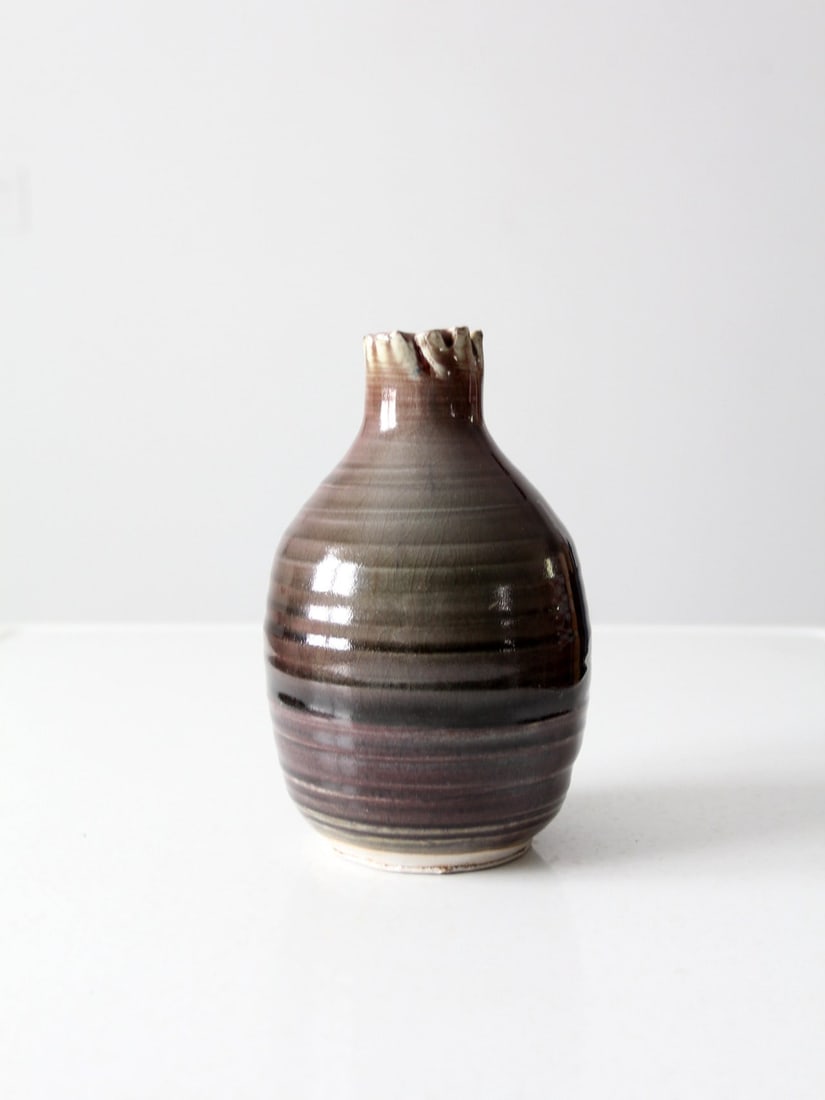 Signed Vintage Studio Pottery Vase with Burgundy Glaze 8 inch: Signed Vintage Studio Pottery Vase with Burgundy Glaze 8 inch This vintage studio pottery vase, crafted around 1996, features a unique free-form folded bottle neck and is adorned with a stunning multi