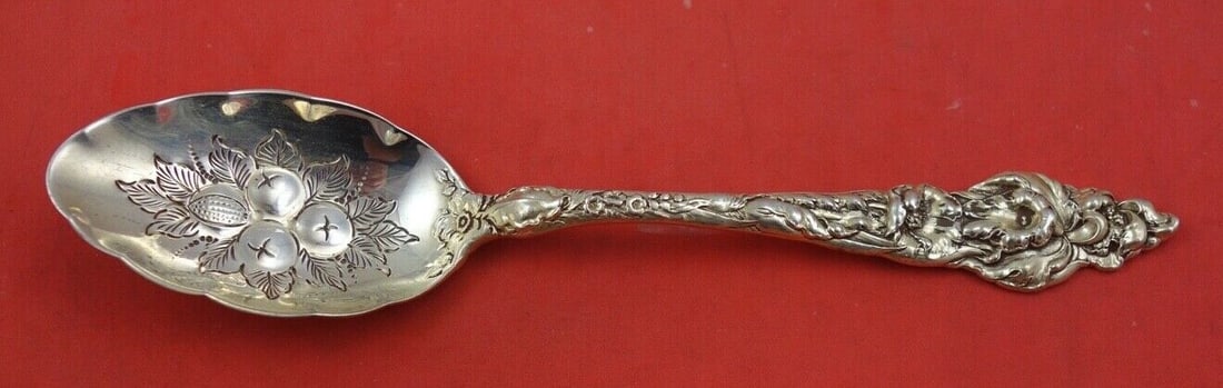 Reed and Barton Les Six Fleurs Sterling Silver Berry Spoon 8 1/4": Reed and Barton Les Six Fleurs Sterling Silver Berry Spoon 8 1/4" This exquisite Les Six Fleurs Berry Spoon by Reed and Barton is crafted from high-quality sterling silver. It features a beautifully d