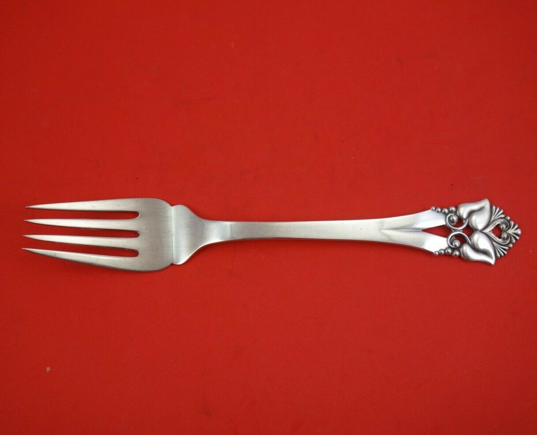 Orla Vagn Mogensen Greta Sterling Silver 4-Tine Serving Fork 8 1/8": Orla Vagn Mogensen Greta Sterling Silver 4-Tine Serving Fork 8 1/8" Discover the elegance of the Greta pattern serving fork, designed by Orla Vagn Mogensen. This exquisite cold meat fork features a cl