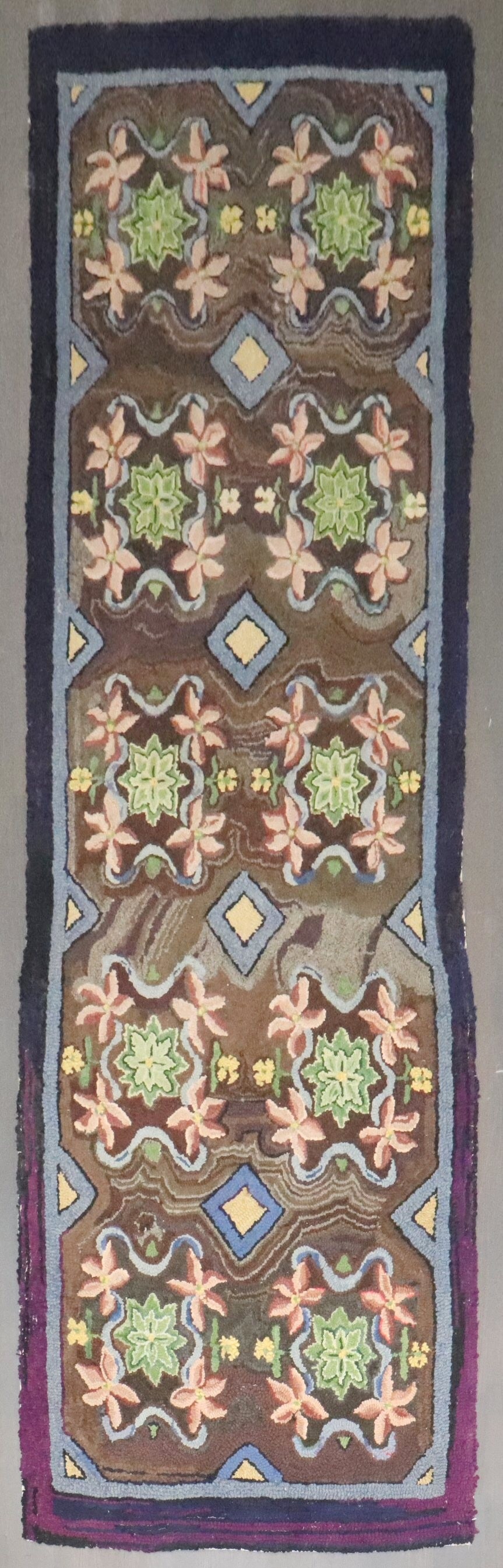 3' 3" x 10' 7" American hooked floral runner rug: 3' 3" x 10' 7" American hooked floral runner rug Mid-20th century American hooked runner with a floral motif. This pre-owned runner offers a classic decorative look and is identified as a hooked type 