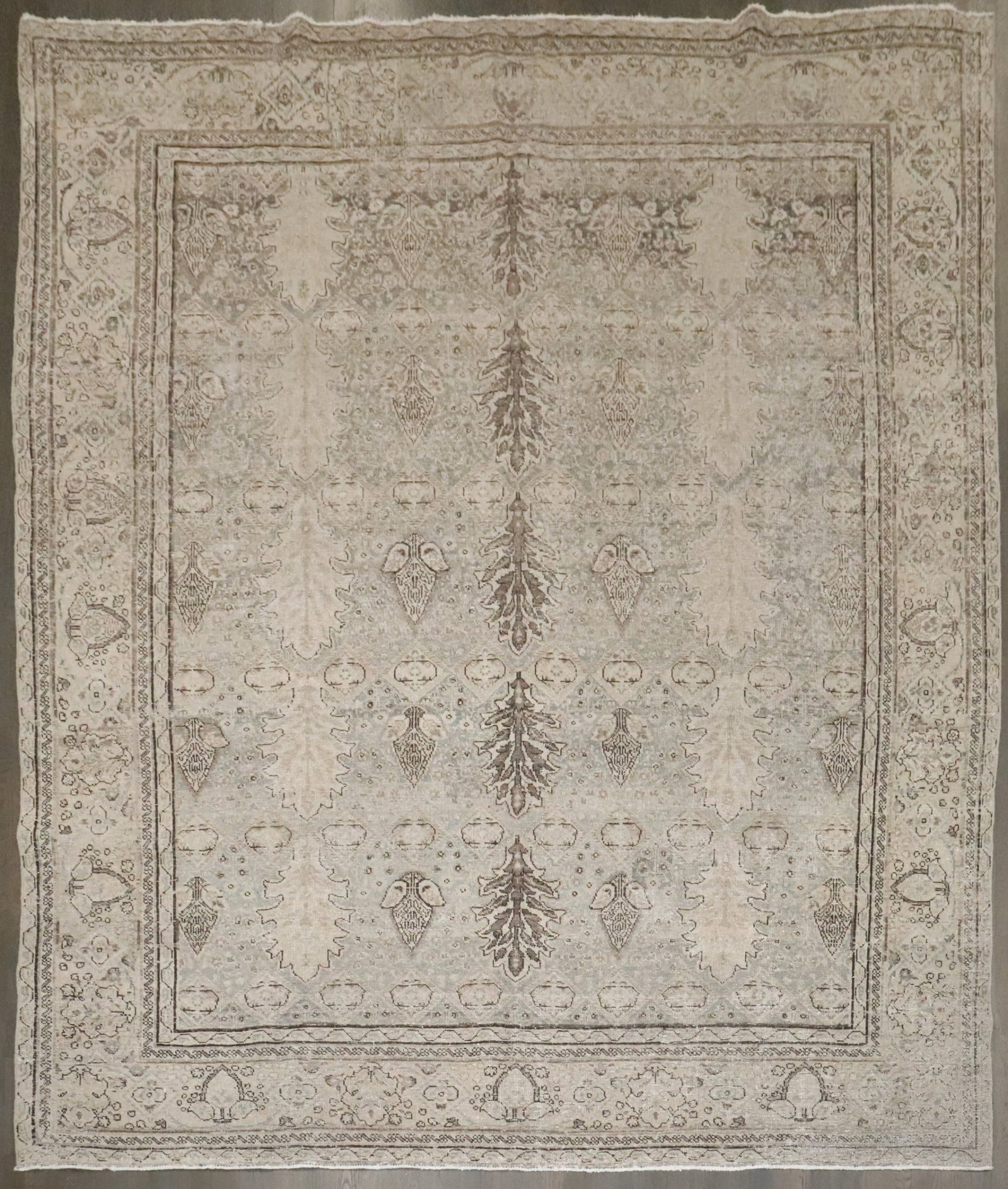 9' 1" x 10' 5" Tabriz wool rug distressed botanical design: 9' 1" x 10' 5" Tabriz wool rug distressed botanical design Antique Tabriz rug featuring an all-over botanical pattern with stylized palmettes, leaves, and small floral motifs instead of a central meda