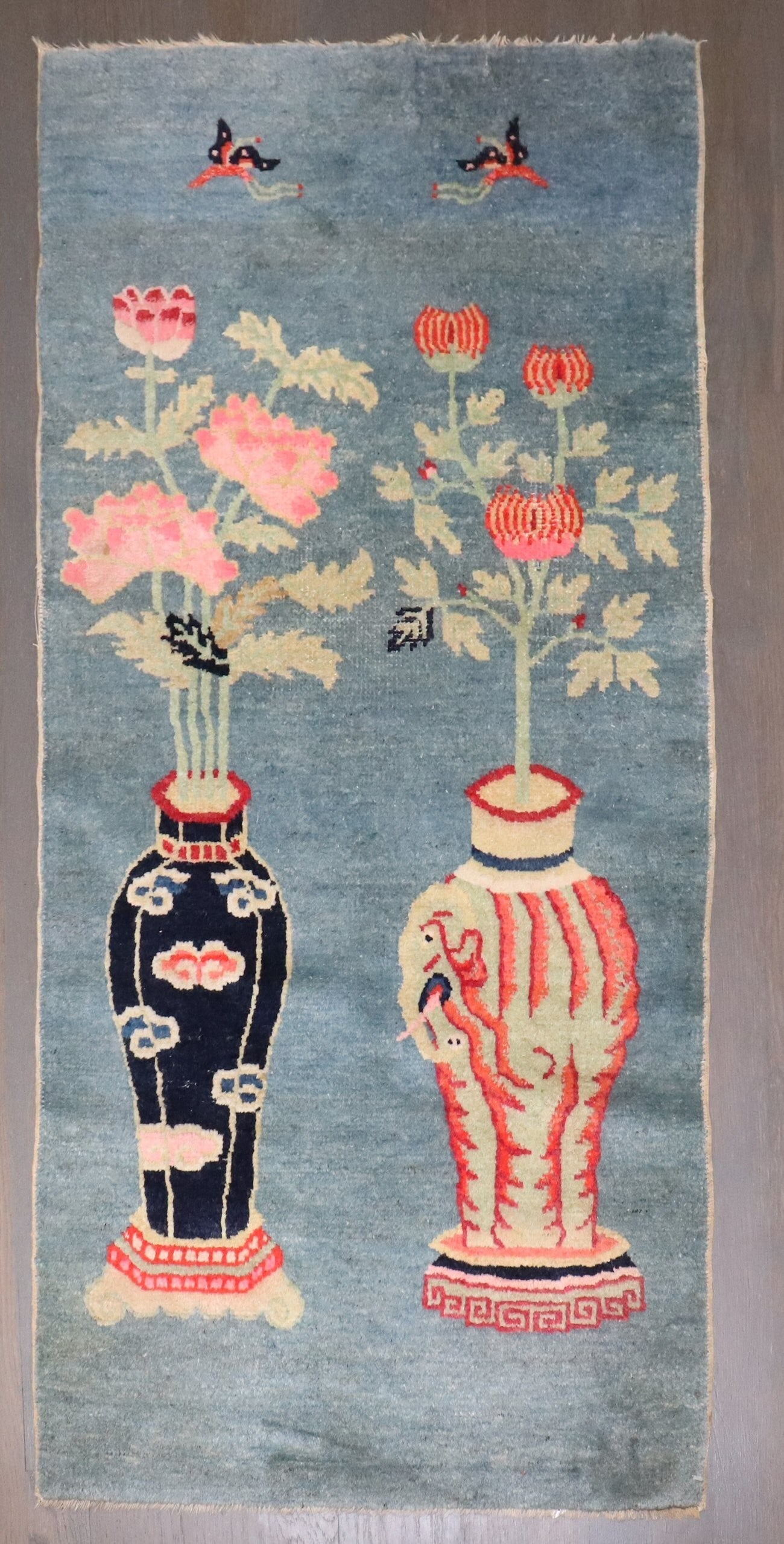 2' x 4' 2" Chinese Batou rug in light blue: 2' x 4' 2" Chinese Batou rug in light blue Early 20th-century Chinese Batou small rug in a light blue colorway. This pre-owned piece offers a classic Batou design in a compact size. Specifications Tit