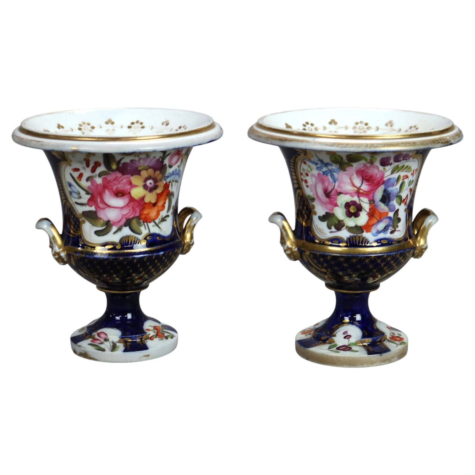 Set of 2 Old Paris porcelain urns in cobalt blue floral decor c 1880: Set of 2 Old Paris porcelain urns in cobalt blue floral decor c 1880 Pair of antique Old Paris cobalt blue porcelain urns with floral design, dating to circa 1880. This set of two features a late 19th