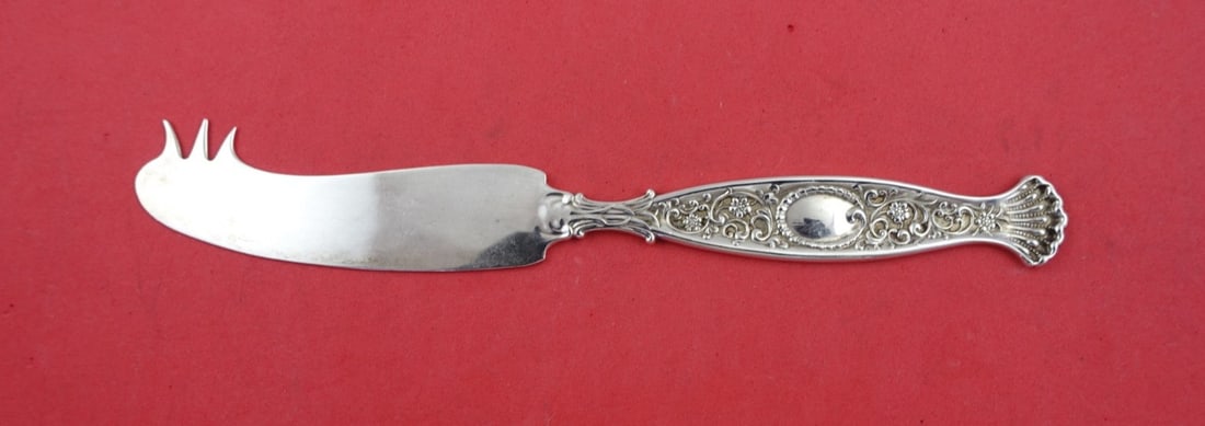 Whiting Hyperion Sterling Silver Cheese Knife with Pick 7 1/4": Whiting Hyperion Sterling Silver Cheese Knife with Pick 7 1/4" This exquisite cheese knife is part of the Hyperion pattern by Whiting, crafted from high-quality sterling silver. Featuring a flat handl