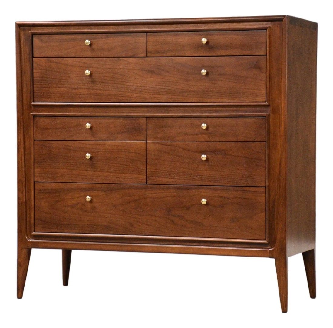 Mid Century Walnut Tall Dresser with Brass Knobs by Mt. Airy: Mid Century Walnut Tall Dresser with Brass Knobs by Mt. Airy This exquisite mid-century modern tall dresser features a refined walnut construction and showcases eight spacious drawers, each adorned wi