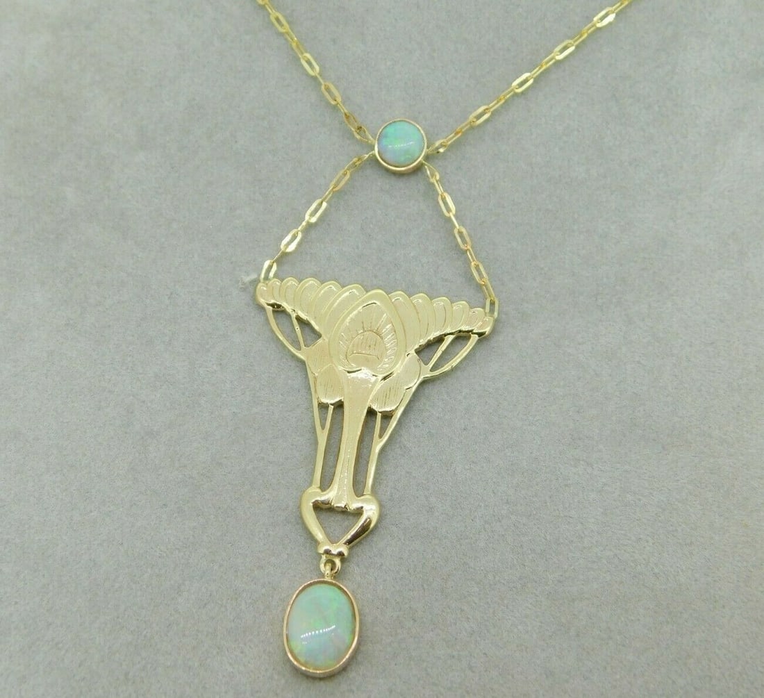 14k Gold Arts and Crafts Opal Festoon Necklace GIA Certified: 14k Gold Arts and Crafts Opal Festoon Necklace GIA Certified Discover the exquisite charm of this 14k Gold Arts and Crafts Style Genuine Natural Opal Festoon Necklace. Crafted in yellow gold, this stu