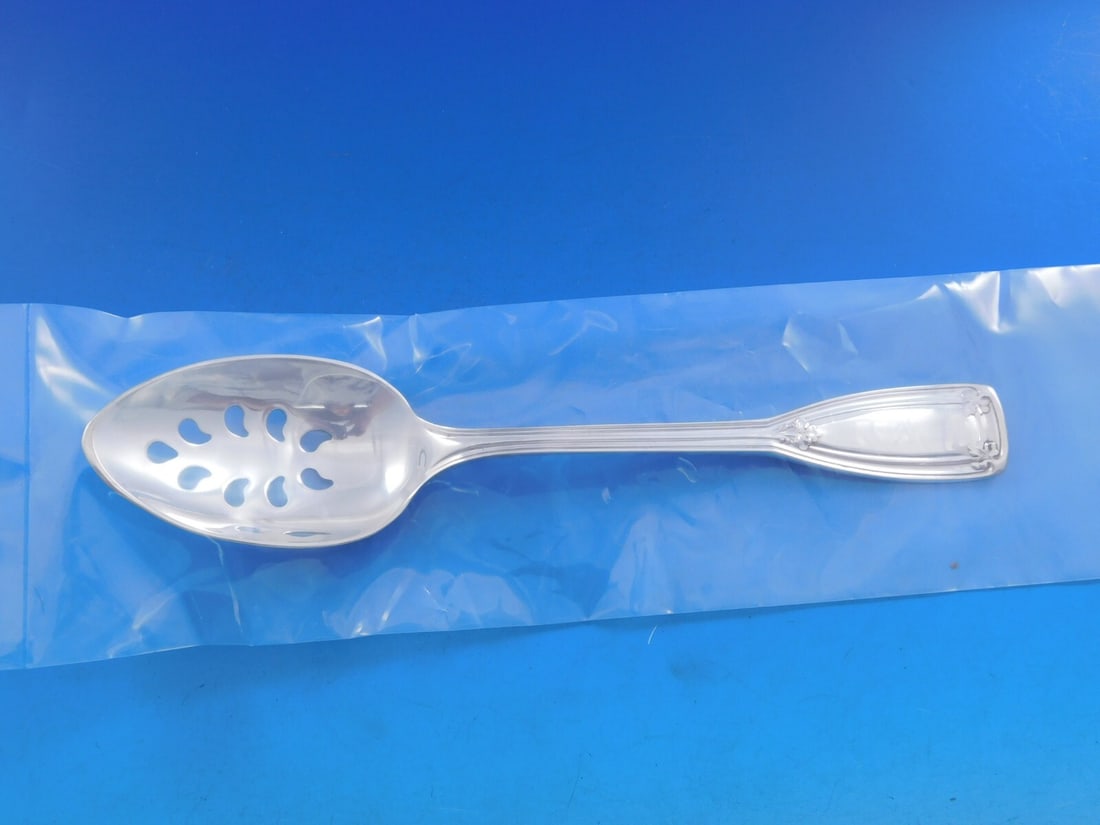 Tiffany & Co. Saint Dunstan Sterling Silver 9-Hole Slotted Spoon: Tiffany & Co. Saint Dunstan Sterling Silver 9-Hole Slotted Spoon This exquisite Saint Dunstan serving spoon by Tiffany & Co. is crafted from high-quality sterling silver, showcasing the elegant design