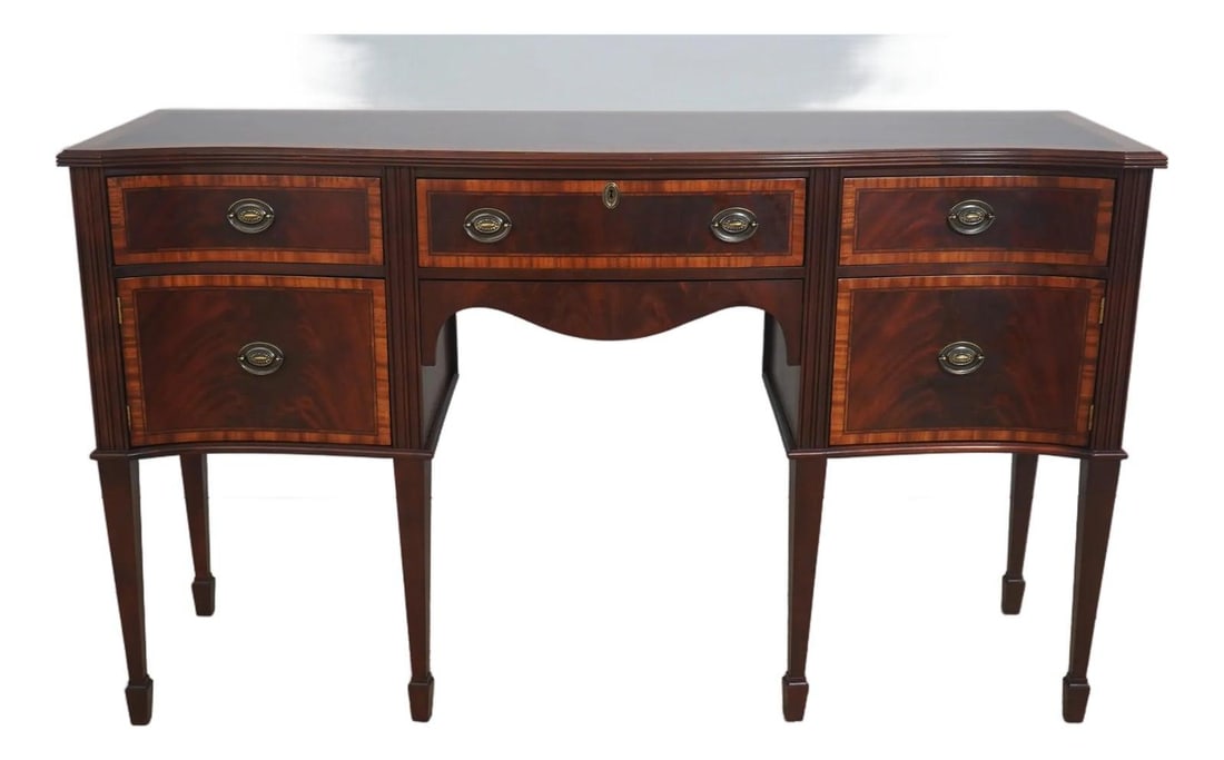 Mahogany Bowfront Sideboard by Craftique Inlaid Brass Hardware 72w x 23d x 42h: Mahogany Bowfront Sideboard by Craftique Inlaid Brass Hardware 72w x 23d x 42h This Craftique bowfront sideboard features high-quality mahogany construction with intricate inlay work throughout. The p