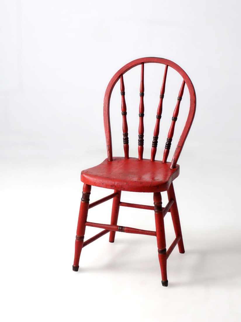Red Painted Antique Windsor Bow Back Chair with Aged Patina: Red Painted Antique Windsor Bow Back Chair with Aged Patina This antique bow back Windsor chair features a beautifully aged red painted finish that enhances its early American character. The curved cr