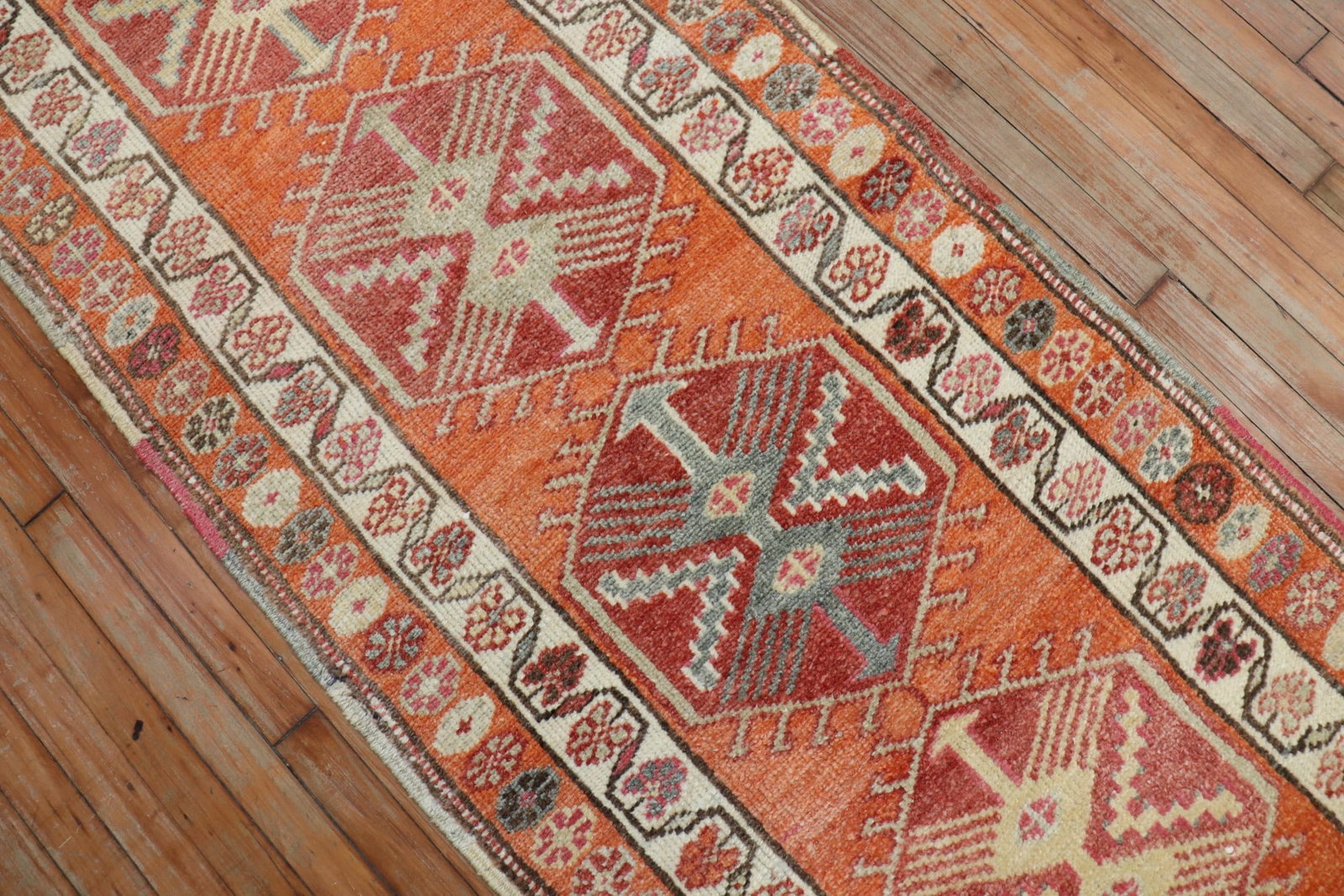 2' 9" x 18' 11" Anatolian Turkish Geometric Runner: 2' 9" x 18' 11" Anatolian Turkish Geometric Runner Mid-20th century Turkish long runner with a geometric design in orange. This pre-owned Anatolian runner presents a classic elongated format suitable 