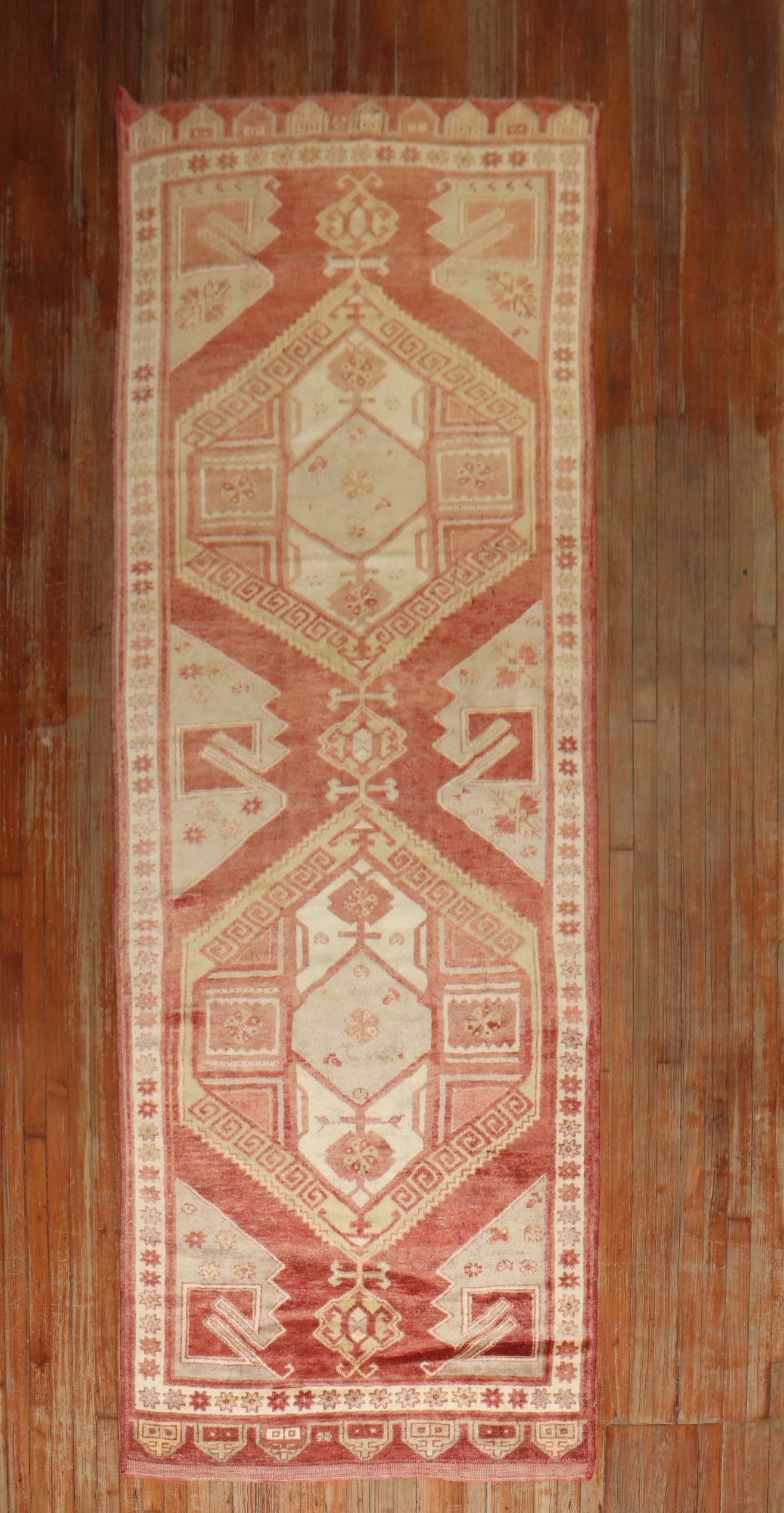 3' 11" x 11' 4" Turkish Konya gallery runner rug: 3' 11" x 11' 4" Turkish Konya gallery runner rug Vintage Turkish Konya wide runner from the mid 20th century. This pre-owned rug is identified as a Konya and falls within the gallery runner category. 