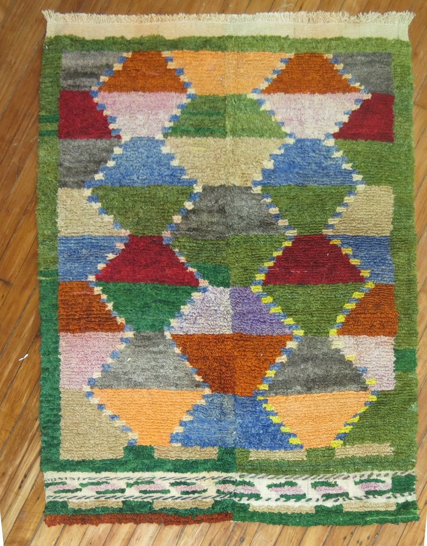 3' 3" x 4' 5" Vintage Turkish Konya Small Rug: 3' 3" x 4' 5" Vintage Turkish Konya Small Rug Vintage Turkish Konya rug featuring a geometric design from the mid-20th century. This pre-owned small rug offers a classic regional style with a compact 