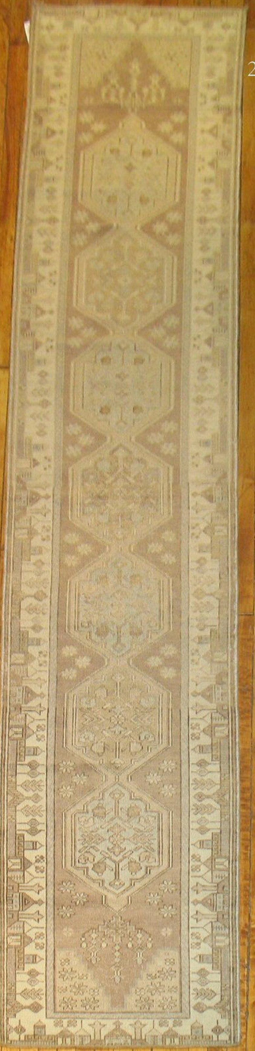 2' 5" x 12' 3" Neutral Turkish Oushak Rug Runner: 2' 5" x 12' 3" Neutral Turkish Oushak Rug Runner Vintage Turkish Oushak runner in a neutral palette with a narrow profile. This mid-20th century rug is a pre-owned piece. Specifications Type: Oushak C