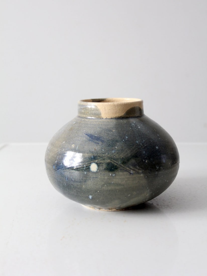 Signed Vintage Studio Pottery Vase Blue Olive Green Glaze 8 Inch: Signed Vintage Studio Pottery Vase Blue Olive Green Glaze 8 Inch This vintage studio pottery vase showcases a unique bulbous shape, crafted by hand and signed by the artist. It features a beautiful bl