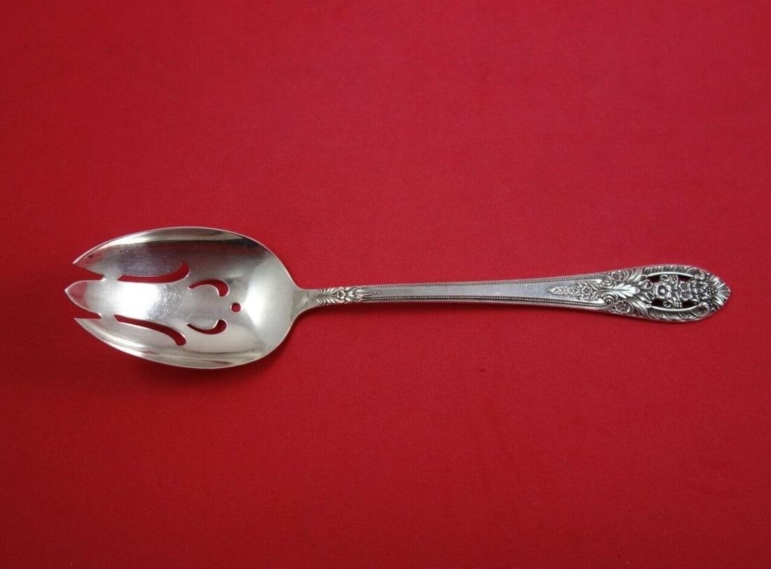 International Sterling Silver Crown Princess Slotted Spoon 8.25": International Sterling Silver Crown Princess Slotted Spoon 8.25" This exquisite slotted serving spoon is crafted from high-quality sterling silver and features the elegant Crown Princess pattern by In