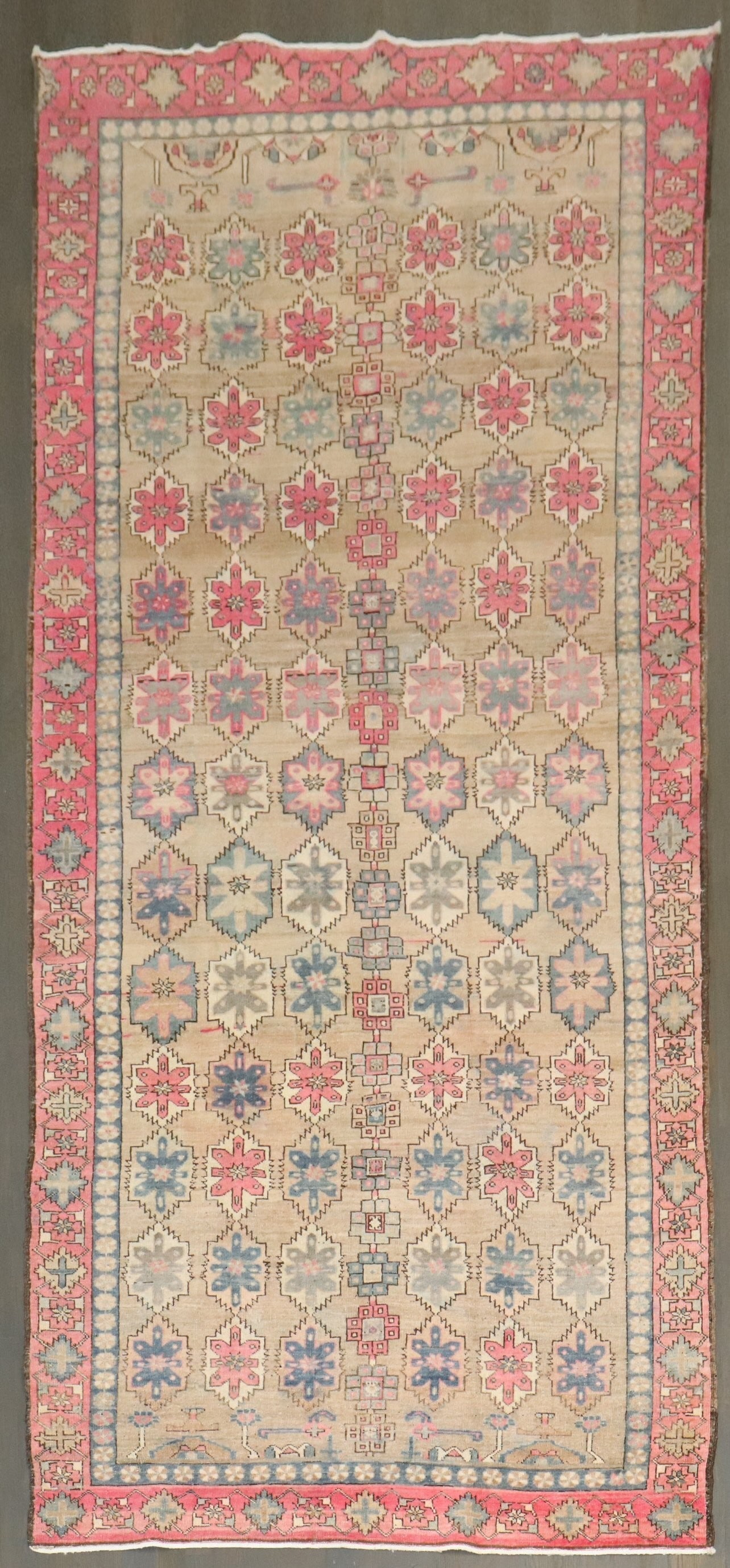 4' 7" x 10' 2" Persian gallery rug camel ground pink accents: 4' 7" x 10' 2" Persian gallery rug camel ground pink accents Vintage mid-20th century Persian gallery rug featuring an all-over repetitive pattern on a camel color ground with pink and gray dominant a