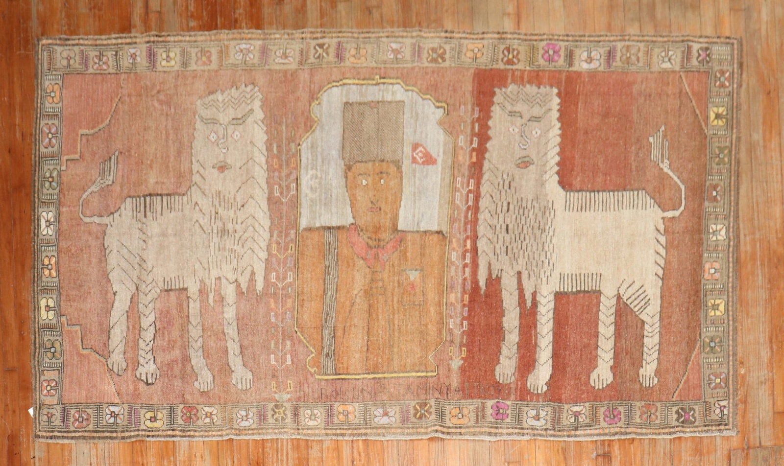 5' 2" x 9' Vintage Turkish Kars Pictorial Rug with Lions: 5' 2" x 9' Vintage Turkish Kars Pictorial Rug with Lions Vintage Turkish Anatolian pictorial rug featuring two large lions flanking a central commander figure. The rug includes inscriptions and is des