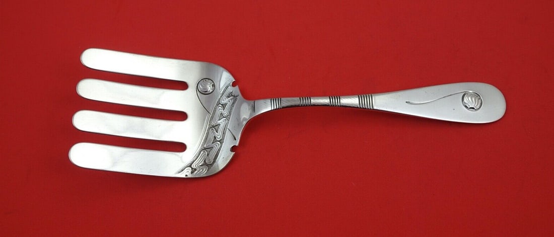 J.E. Caldwell Poppy Sterling Silver Asparagus Fork 9 1/8": J.E. Caldwell Poppy Sterling Silver Asparagus Fork 9 1/8" This exquisite serving fork is part of the Poppy pattern designed by J.E. Caldwell. Crafted from high-quality sterling silver, it features a