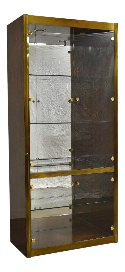 Mastercraft Zebrano Wood Brass Display Cabinet with Glass Doors: Mastercraft Zebrano Wood Brass Display Cabinet with Glass Doors This elegant display cabinet showcases a striking zebrano wood construction, expertly crafted by Mastercraft. It features brass accents 