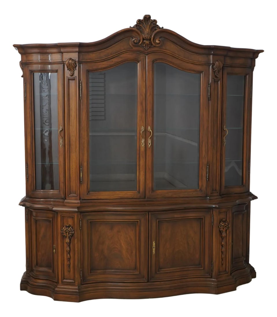 Karges French Walnut China Cabinet with Curved Glass Doors: Karges French Walnut China Cabinet with Curved Glass Doors This exquisite Karges French Style China Cabinet showcases a beautiful walnut finish with fine carved details. The cabinet features elegant c
