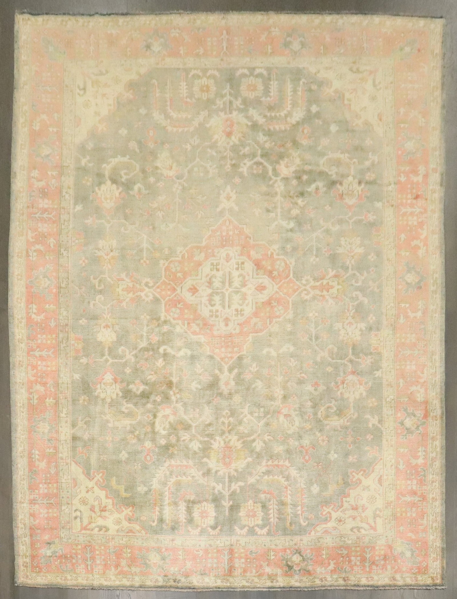 8' 3" x 11' 2" Antique Turkish Oushak Room Rug Green Pink: 8' 3" x 11' 2" Antique Turkish Oushak Room Rug Green Pink Antique Turkish Oushak rug from the 1920s in a soft green palette with pink accents. This pre-owned room-size rug retains the classic Oushak c