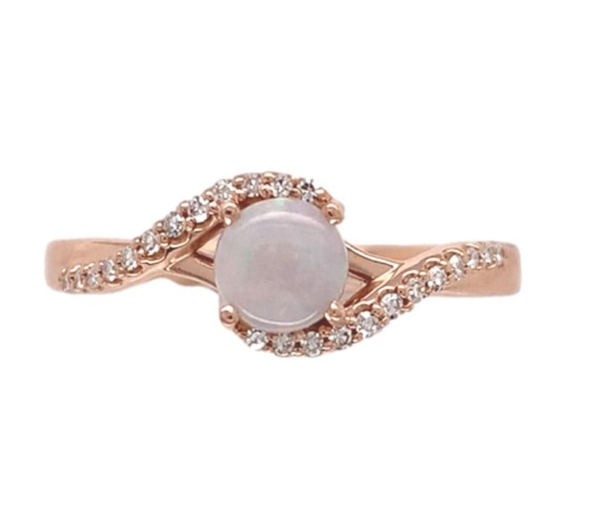 14k Rose Gold Opal Diamond Ring Size 7: 14k Rose Gold Opal Diamond Ring Size 7 This elegant ring is crafted from 14k rose gold and features a genuine natural Australian opal as its centerpiece. The opal, cut in a round cabochon shape, weigh