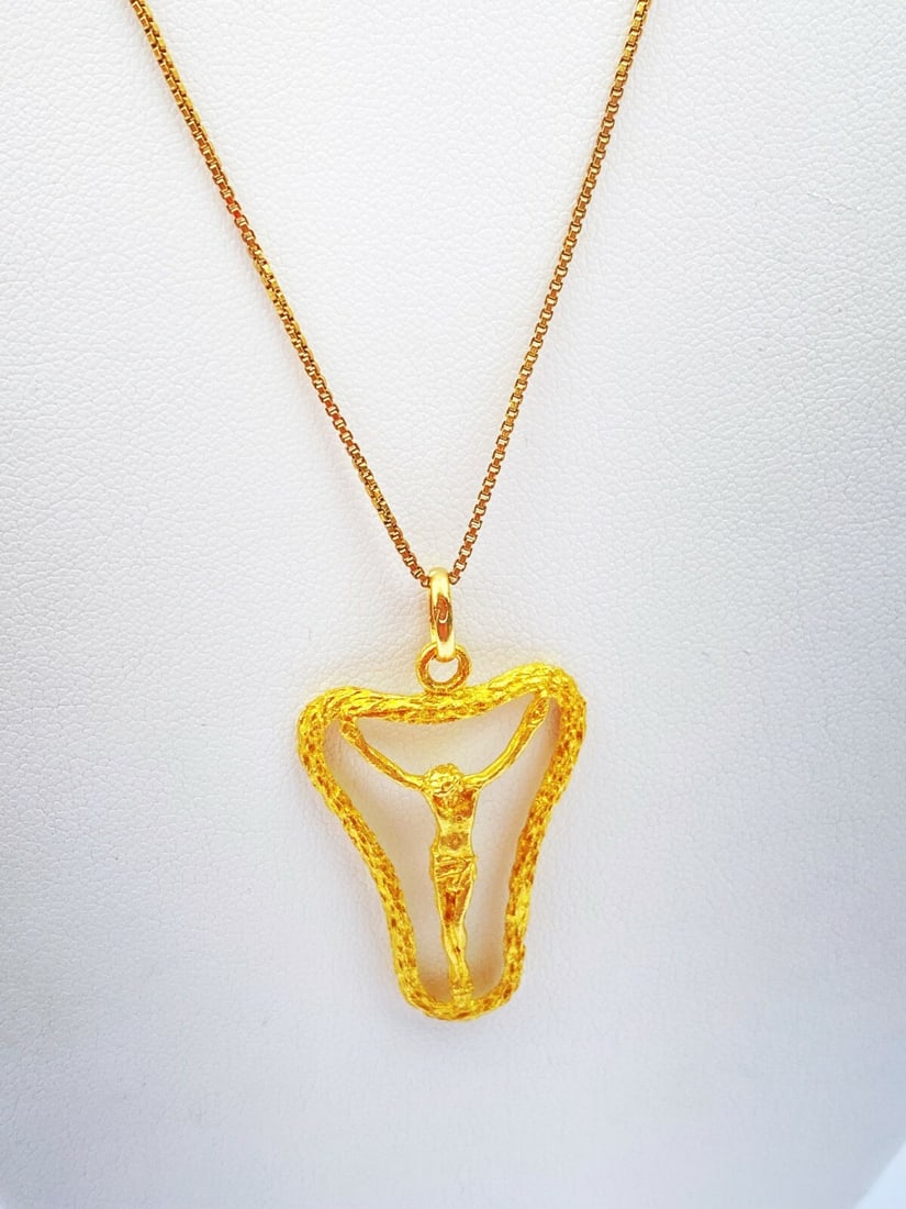 French 18K Yellow Gold Crucifix Necklace 28" Signed: French 18K Yellow Gold Crucifix Necklace 28" Signed This exquisite French crucifix necklace features a stunning 18K yellow gold chain, measuring 28 inches in length. The intricately designed crucifix