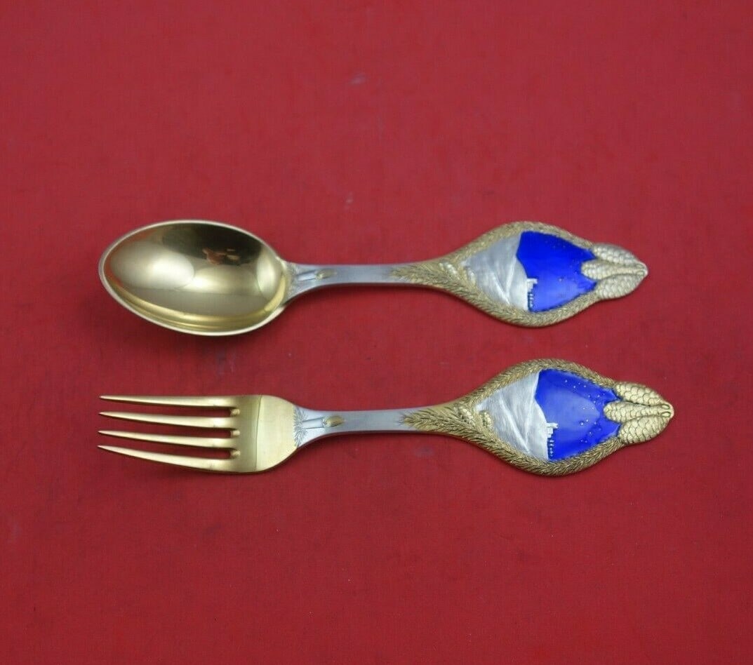 A. Michelsen 1913 Christmas Sterling Silver Fork Spoon Set 2pc Vermeil Enameled: A. Michelsen 1913 Christmas Sterling Silver Fork Spoon Set 2pc Vermeil Enameled Celebrate the festive season with this exquisite 2-piece Sterling Silver Fork and Spoon Set by A. Michelsen, crafted in