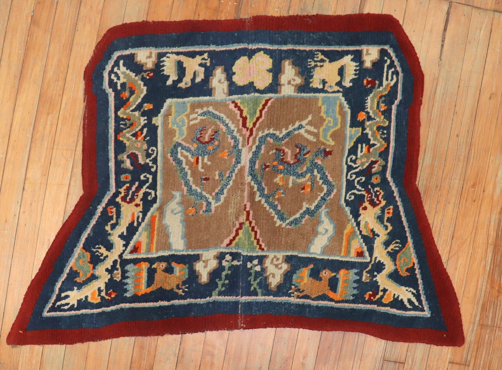 2' 5" x 4' Tibetan Pictorial Horse Cover Rug with Dragon: 2' 5" x 4' Tibetan Pictorial Horse Cover Rug with Dragon Early 20th century Tibetan dragon horse cover textile rug with a pictorial design. This pre-owned small-format rug is identified as a Tibetan t
