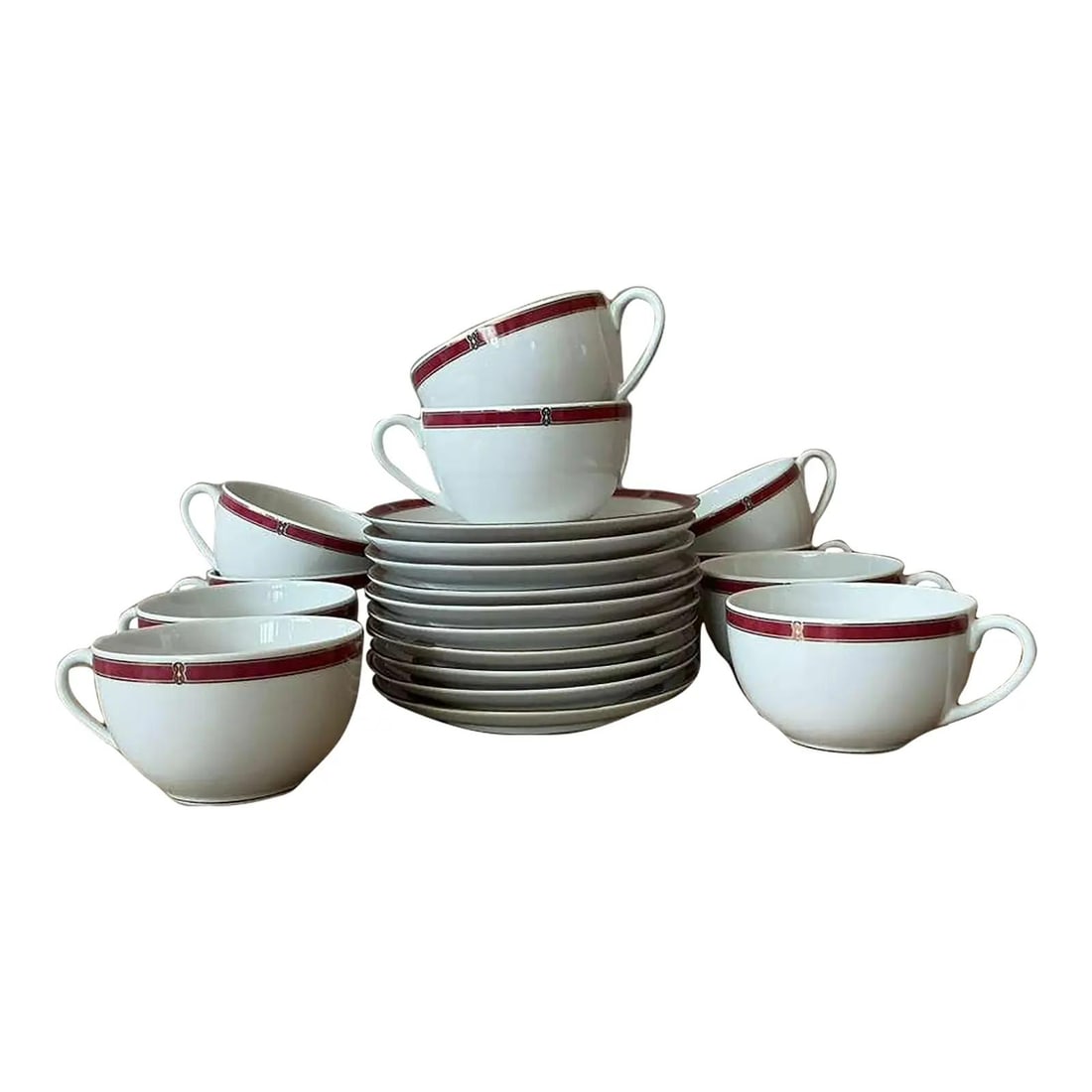 Set of 11 Porcelain Oceana Red Tea Cups and Saucers by Christofle: Set of 11 Porcelain Oceana Red Tea Cups and Saucers by Christofle This set of 11 Christofle "Oceana Red" tea cups with matching saucers features the vibrant Oceana Red pattern, highlighted by coral-re