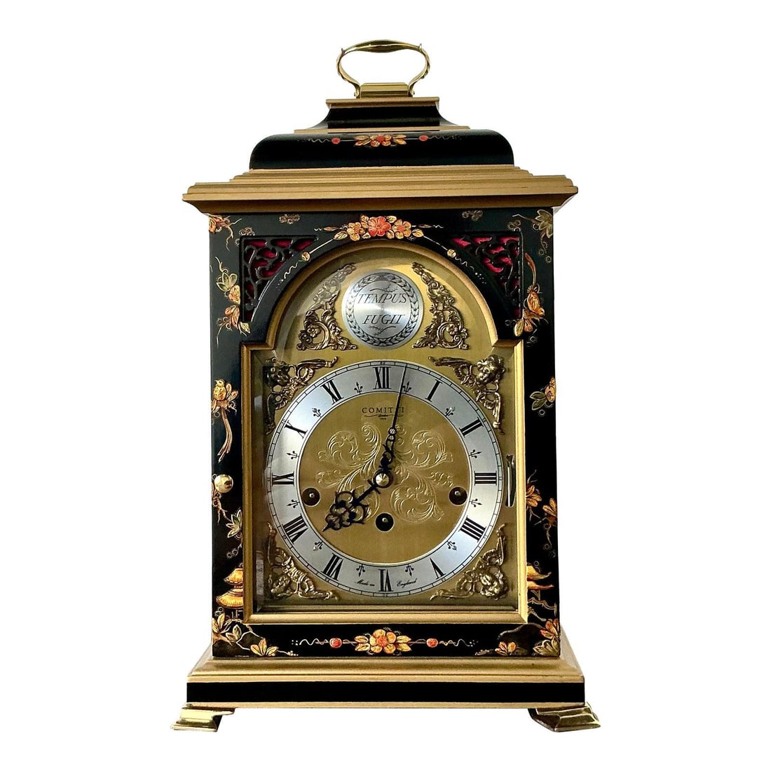 Chinoiserie Black Lacquer Mantel Clock with Floral and Bird Motif by Comitti: Chinoiserie Black Lacquer Mantel Clock with Floral and Bird Motif by Comitti This vintage Comitti of London mantel clock showcases traditional English horology with Chinoiserie-inspired details. The b