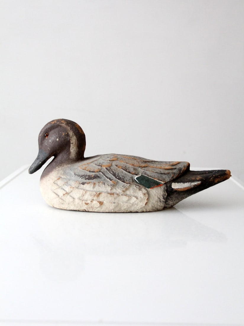 Mallard Hen Duck Decoy with Aged Painted Finish by Carry Lite: Mallard Hen Duck Decoy with Aged Painted Finish by Carry Lite This vintage Carry Lite mallard hen duck decoy features an elongated profile with a gently defined feather pattern. The painted surface ex