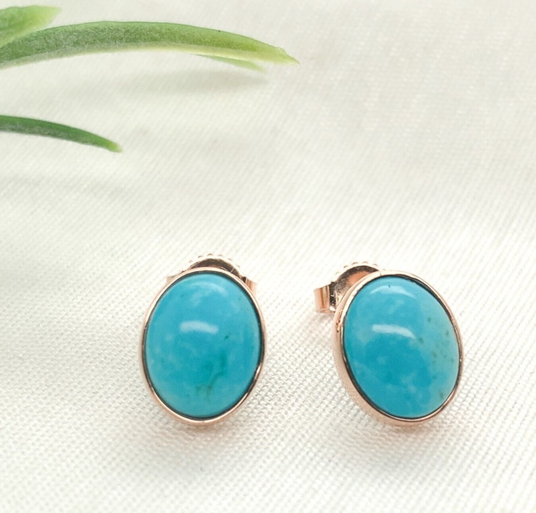 14k Rose Gold Kingman Turquoise Stud Earrings 3.12 Carats GIA Certified: 14k Rose Gold Kingman Turquoise Stud Earrings 3.12 Carats GIA Certified These exquisite stud earrings feature genuine Kingman turquoise set in 14k rose gold. Each earring showcases an oval-shaped turq