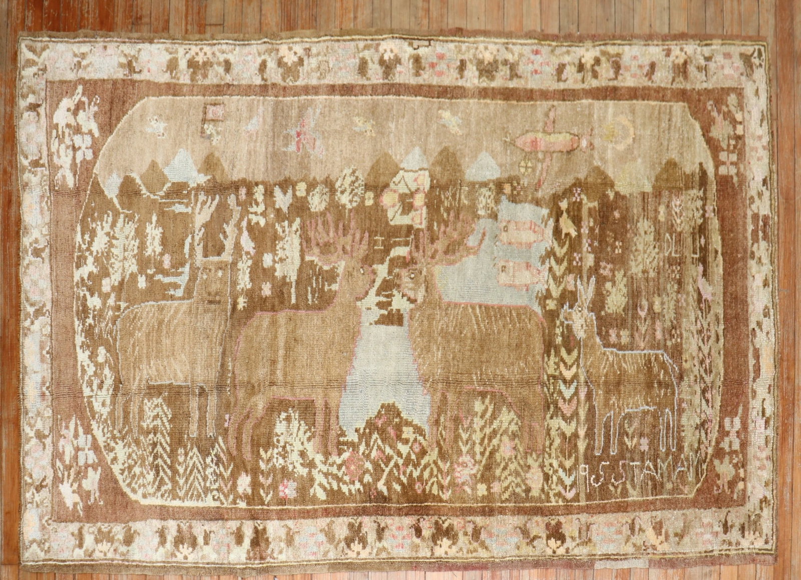 5' x 7' 9" Turkish Kars pictorial rug with 4 deer: 5' x 7' 9" Turkish Kars pictorial rug with 4 deer Mid 20th century Turkish pictorial rug featuring four deer in predominantly brown tones. This pre-owned rug is identified as a Kars pictorial example.