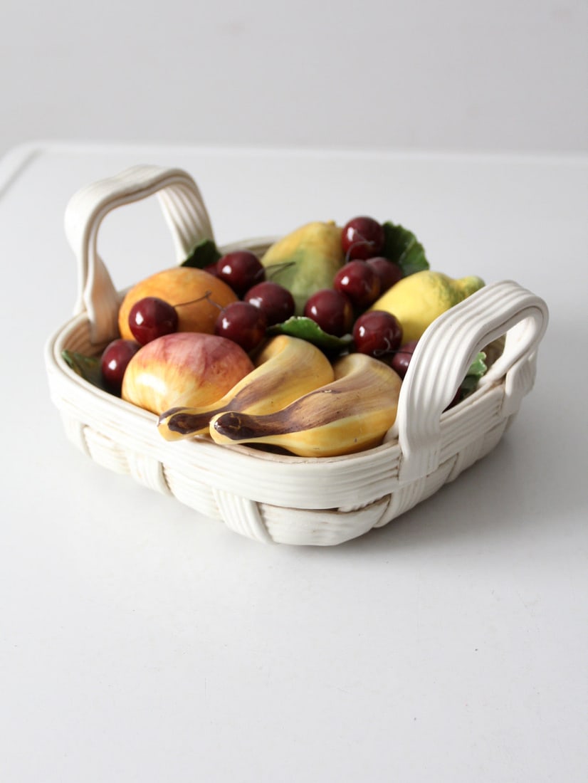 Vintage Mid-Century Italian Pottery Fruit Basket Sculpture: Vintage Mid-Century Italian Pottery Fruit Basket Sculpture This exquisite mid-20th century vintage Italian pottery sculpture showcases a lively fruit basket filled with colorful ceramic cherries, peac