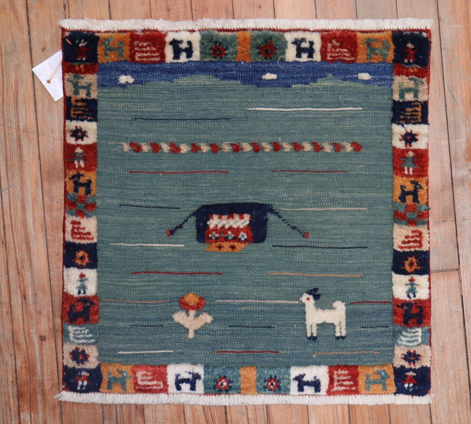 1' 8" x 1' 9" Persian Gabbeh Souf Square Mat: 1' 8" x 1' 9" Persian Gabbeh Souf Square Mat Late 20th century Persian Gabbeh Souf mat featuring a pictorial design. Souf rugs use a combination of flat-weave and pile construction, creating a distinc