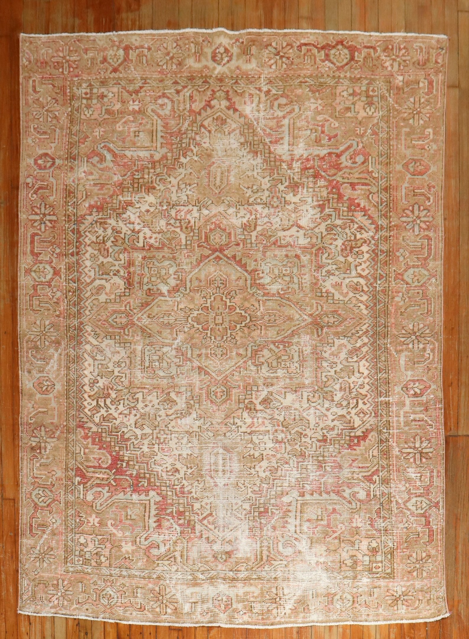 6' 1" x 8' 1930s Persian Heriz rug feminine colors: 6' 1" x 8' 1930s Persian Heriz rug feminine colors A 1930s Persian Heriz rug in feminine colors with a worn look. Classified as Serapi/Heriz and Shabby Chic, this pre-owned rug features an intricate p