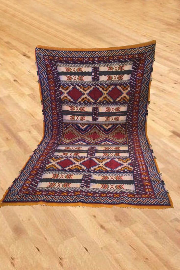 Traditional Moroccan Taznakht Handmade Wool Area Rug 260 x 155cm: Traditional Moroccan Taznakht Handmade Wool Area Rug 260 x 155cm Enhance your space with this traditional Moroccan Taznakht area rug. Crafted by skilled Berber weavers, this colorful rug is made of 10
