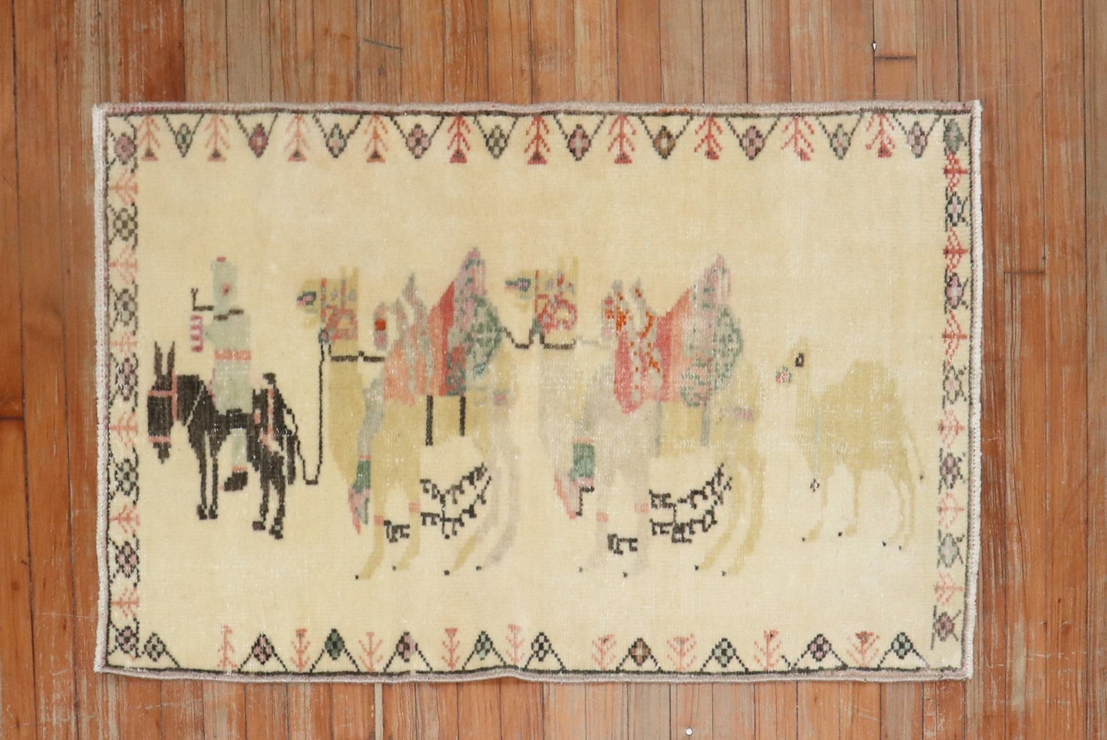 2' 4" x 3' 11" Turkish Anatolian Pictorial Rug Caravan Design: 2' 4" x 3' 11" Turkish Anatolian Pictorial Rug Caravan Design Mid 20th century Turkish Anatolian pictorial rug featuring a caravan design. This small pre-owned rug presents a decorative animal motif w
